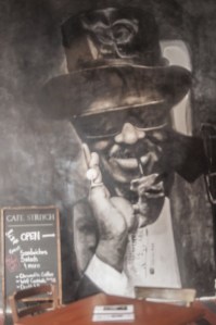 Image taken from Kirk’s album RETURN OF THE 5000 lb. MAN and rendered 10 feet tall on the wall to the immediate left upon entering Café Stritch.